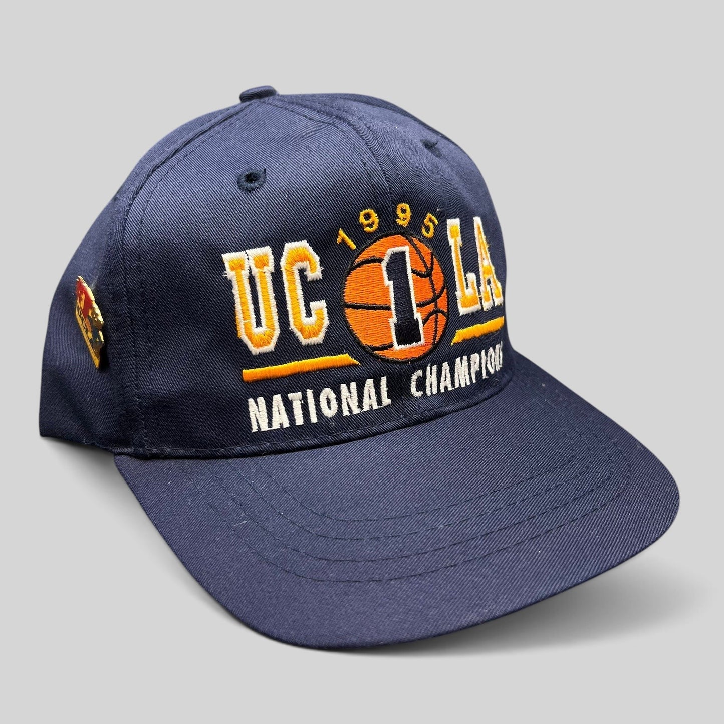Raree Finds vintage 1995 UCLA Bruins National Champions navy blue snapback hat with embroidered basketball graphic