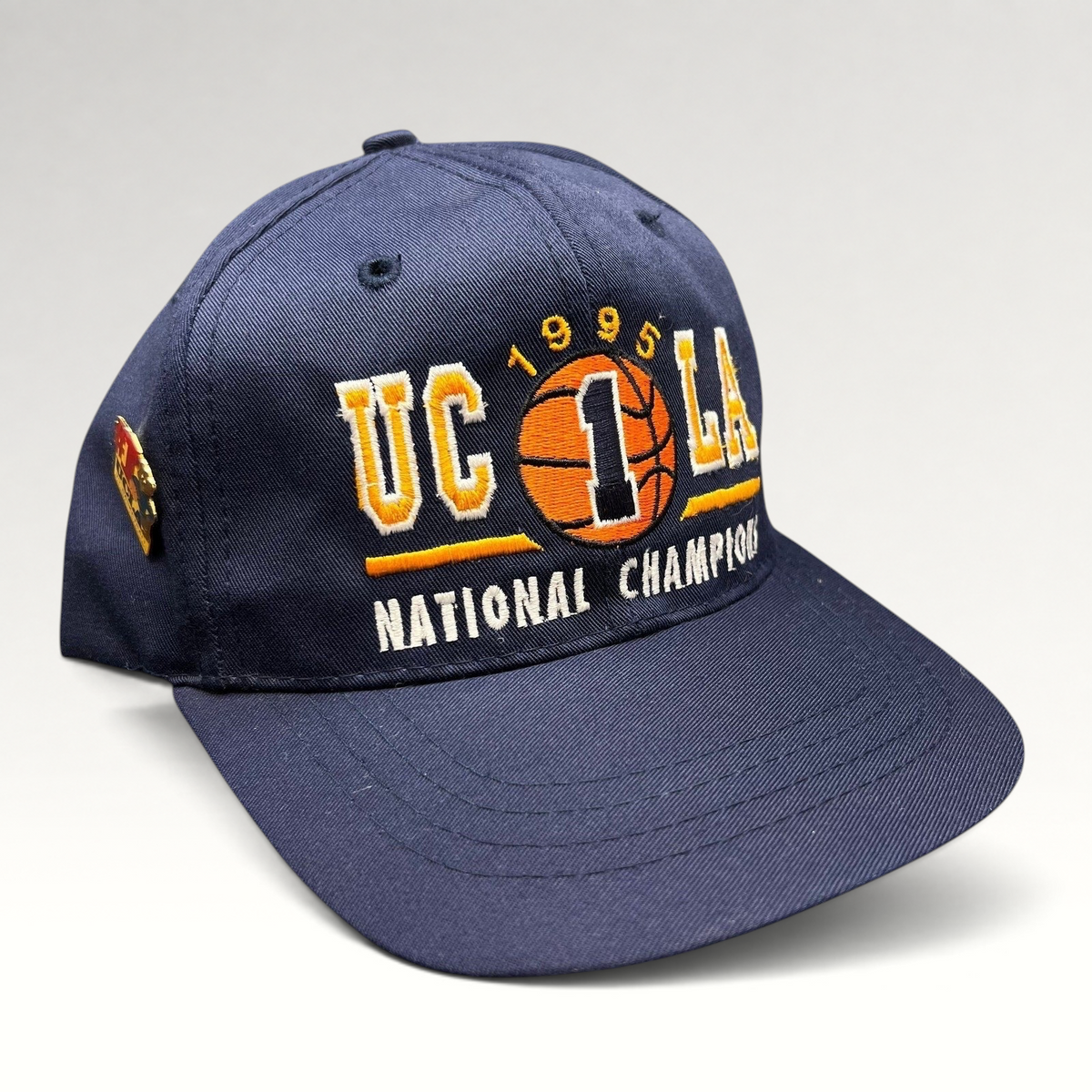 Raree Finds vintage 1995 UCLA Bruins National Champions navy blue snapback hat with embroidered basketball graphic