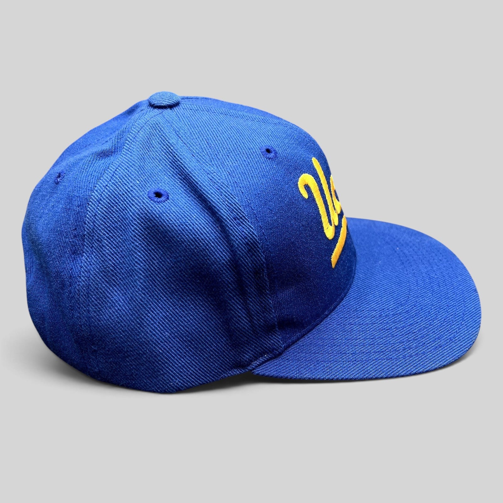 Raree Finds vintage UCLA Bruins royal blue snapback hat with gold script embroidery and structured six-panel design
