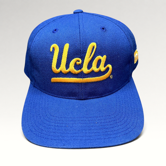 Raree Finds vintage UCLA Bruins royal blue snapback hat with gold script embroidery and structured six-panel design.