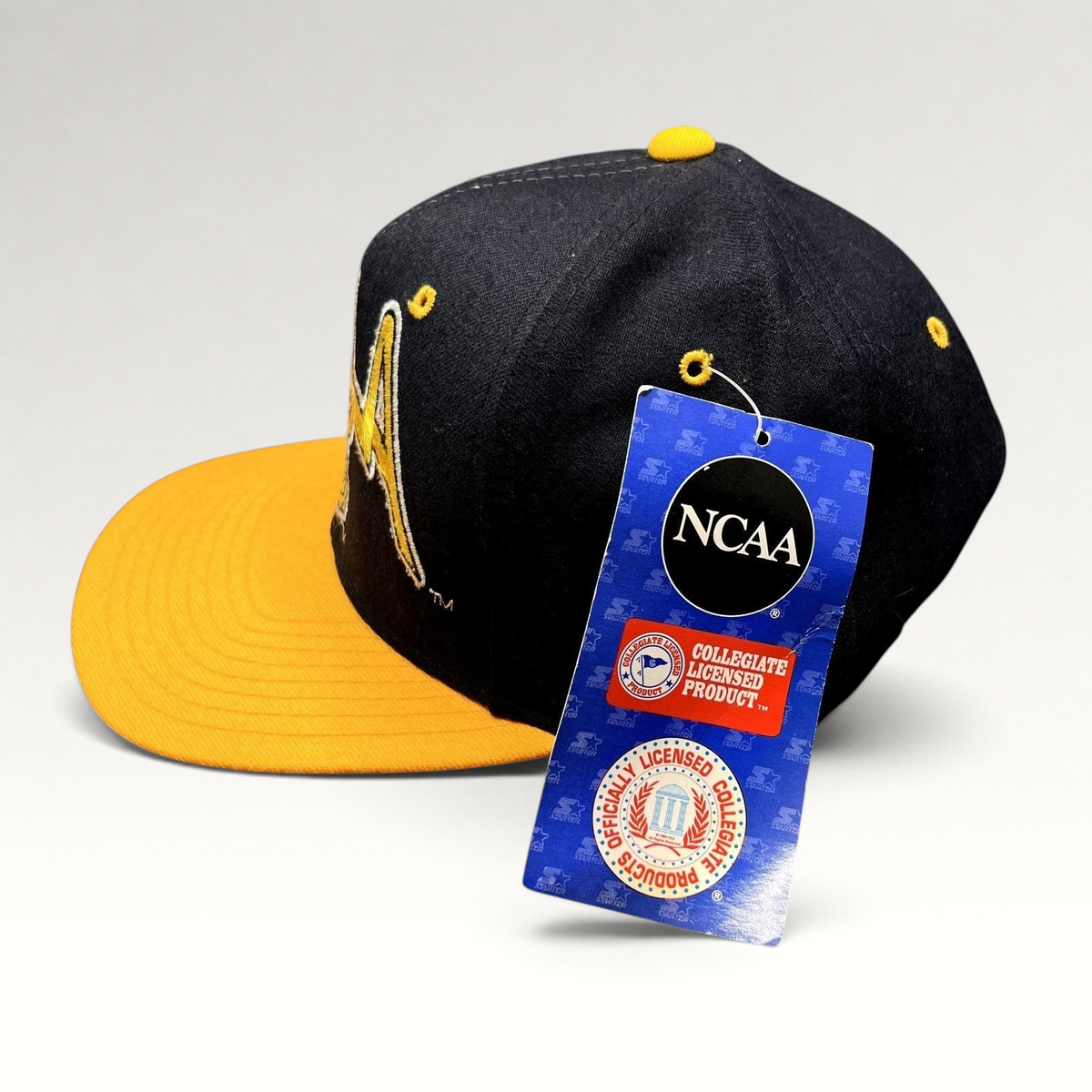 Raree Finds vintage UCLA Bruins wool snapback hat in navy and gold with Starter tag and NCAA branding