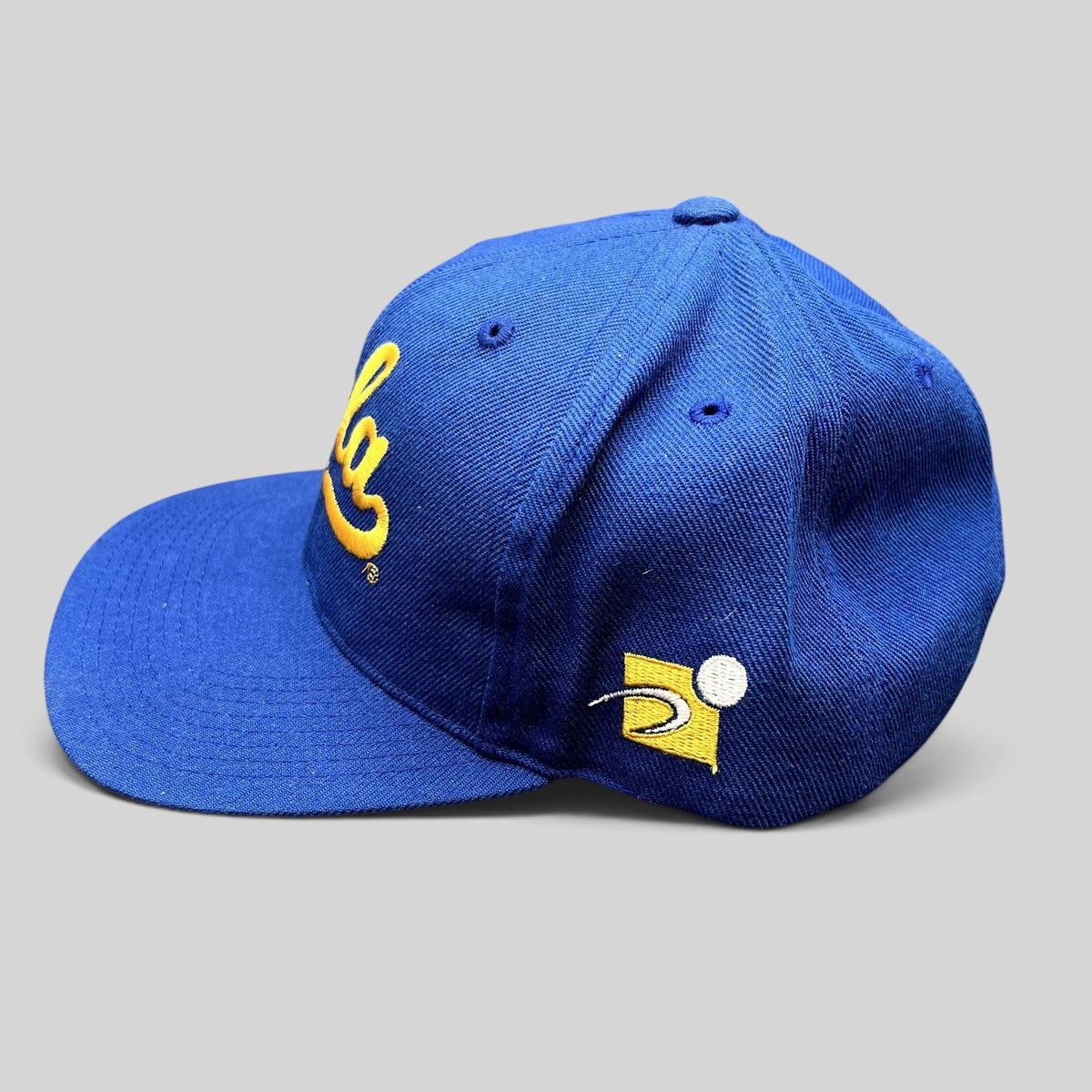 Raree Finds vintage UCLA Bruins royal blue snapback hat with gold script embroidery and side logo detail