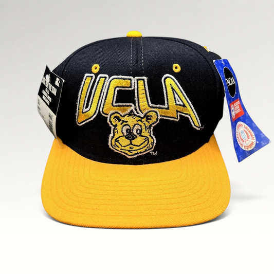 Raree Finds vintage UCLA Bruins wool snapback hat in navy and gold with embroidered bear mascot and Starter tags.