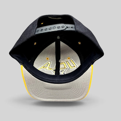 Raree Finds vintage UCLA Bruins Starter snapback hat showing the interior crown, adjustable strap, and gold brim