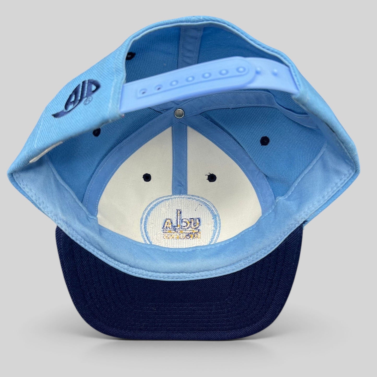 Raree Finds vintage AJD UCLA Bruins snapback hat interior view showing the adjustable strap and embroidered logo