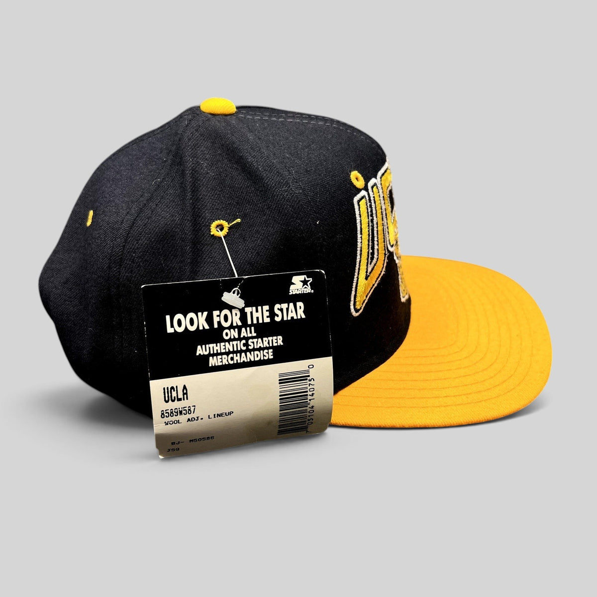 Raree Finds vintage UCLA Bruins Starter snapback hat in navy and gold wool with original tags attached
