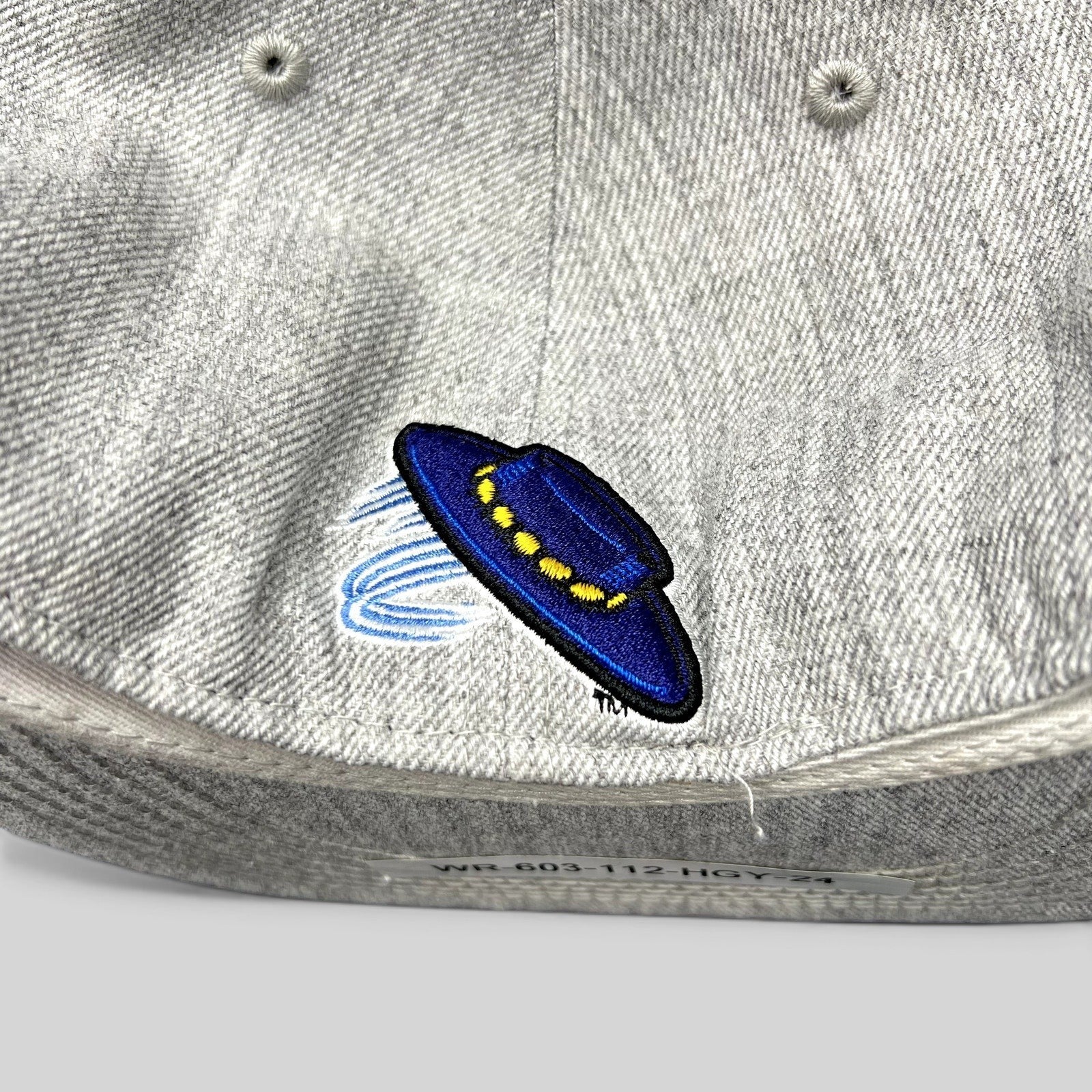 Raree Finds UCSB Gauchos fitted hat featuring a detailed blue and yellow embroidered UFO logo on heather gray fabric.