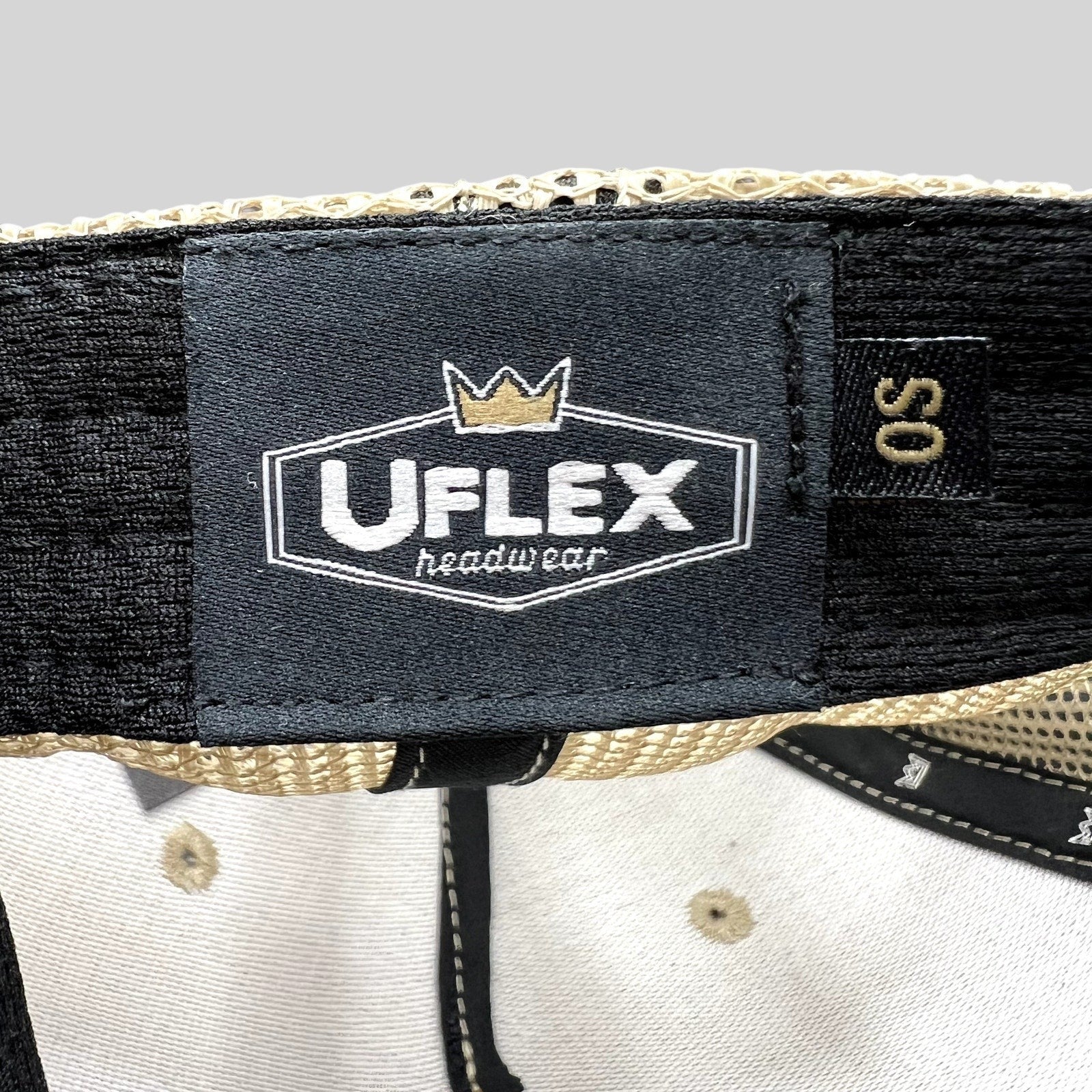 Raree Finds UFlex interior label and OS size tag inside a cream corduroy trucker hat with beige mesh panels