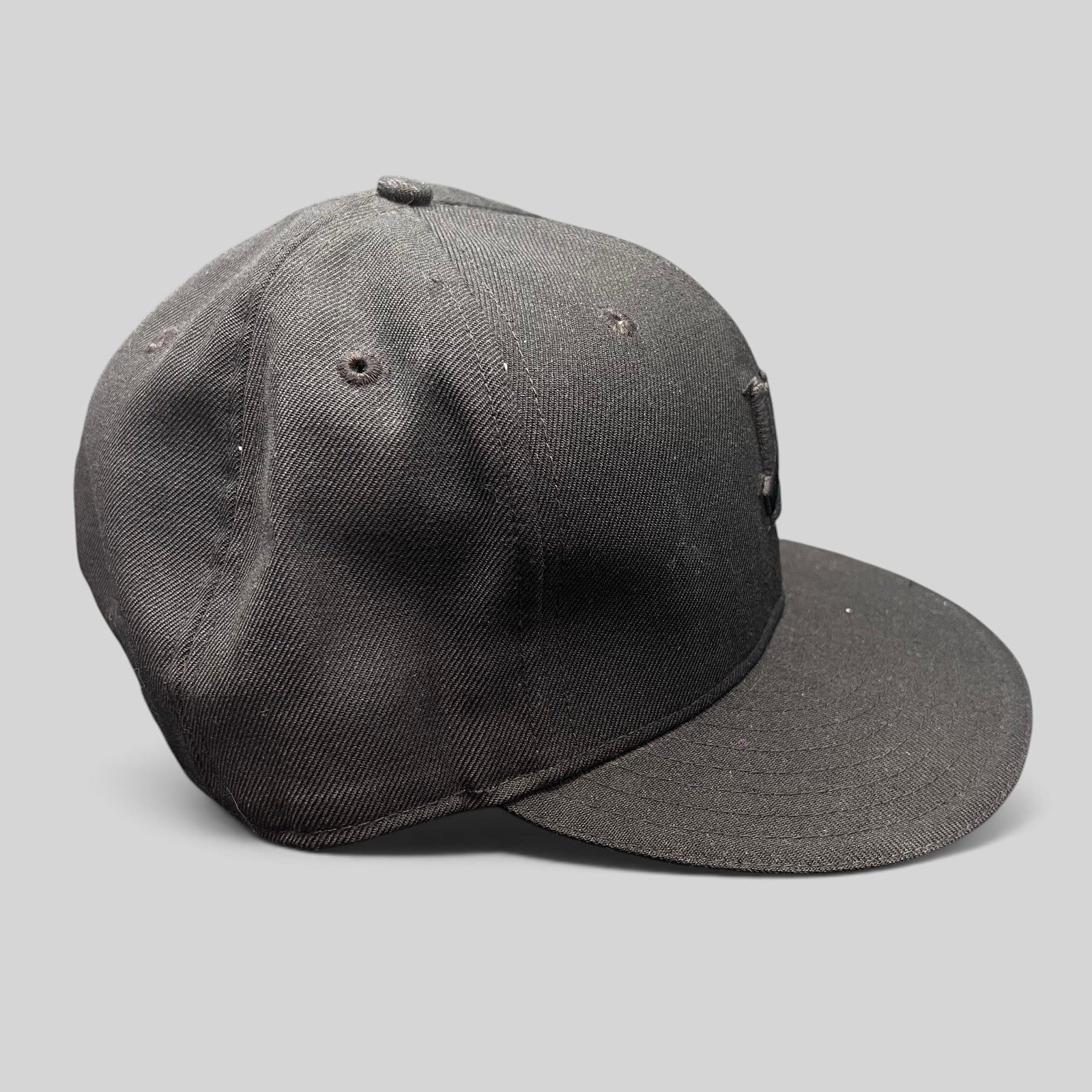 Raree Finds black Undefeated 59FIFTY fitted cap with tonal Five Strike logo embroidery on a structured wool blend