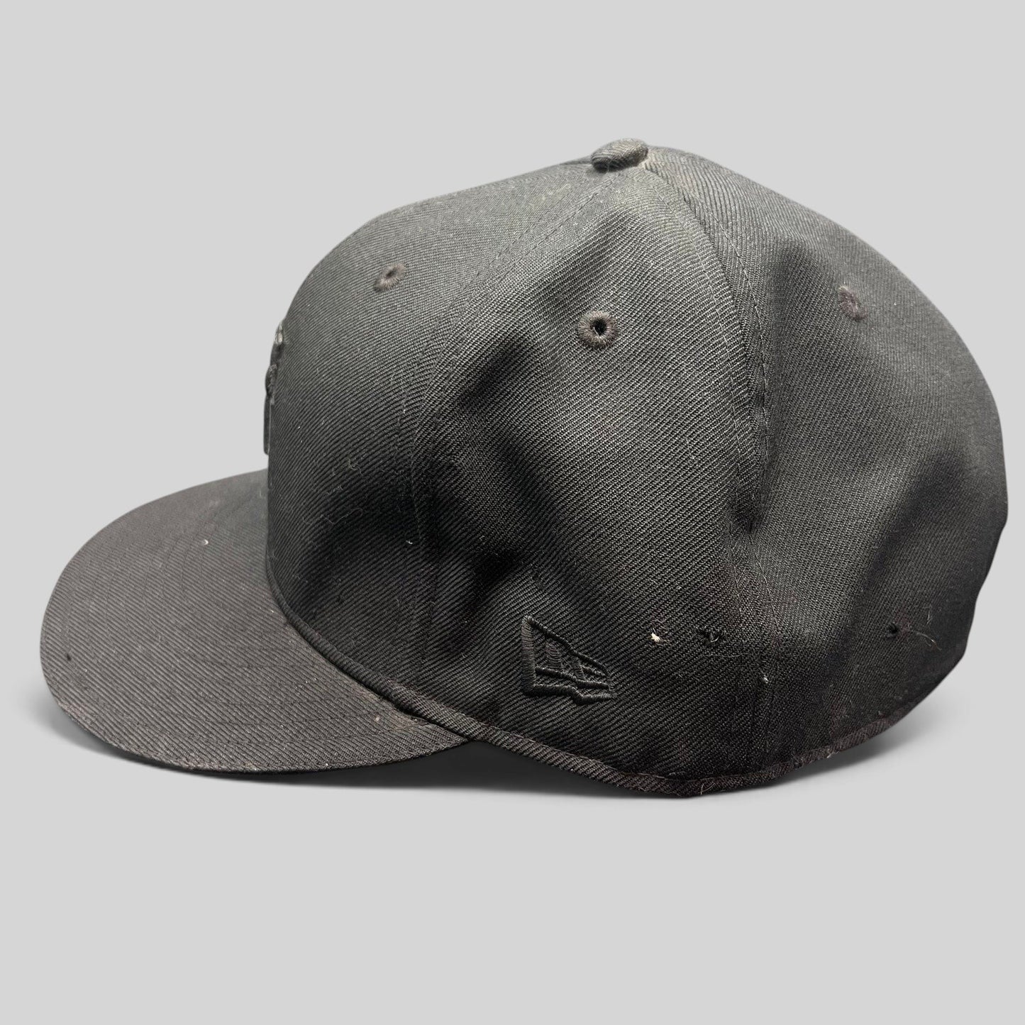 Raree Finds Undefeated x New Era 59FIFTY fitted hat in all black with tonal embroidered logo and flat brim