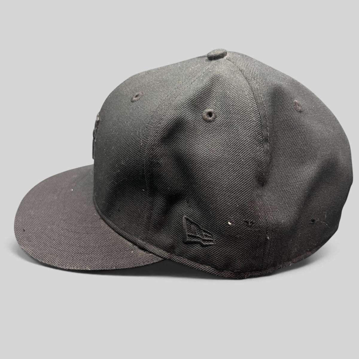 Raree Finds Undefeated x New Era 59FIFTY fitted hat in all black with tonal embroidered logo and flat brim