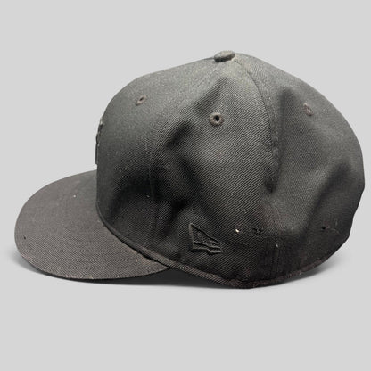 Raree Finds Undefeated x New Era 59FIFTY fitted hat in all black with tonal embroidered logo and flat brim