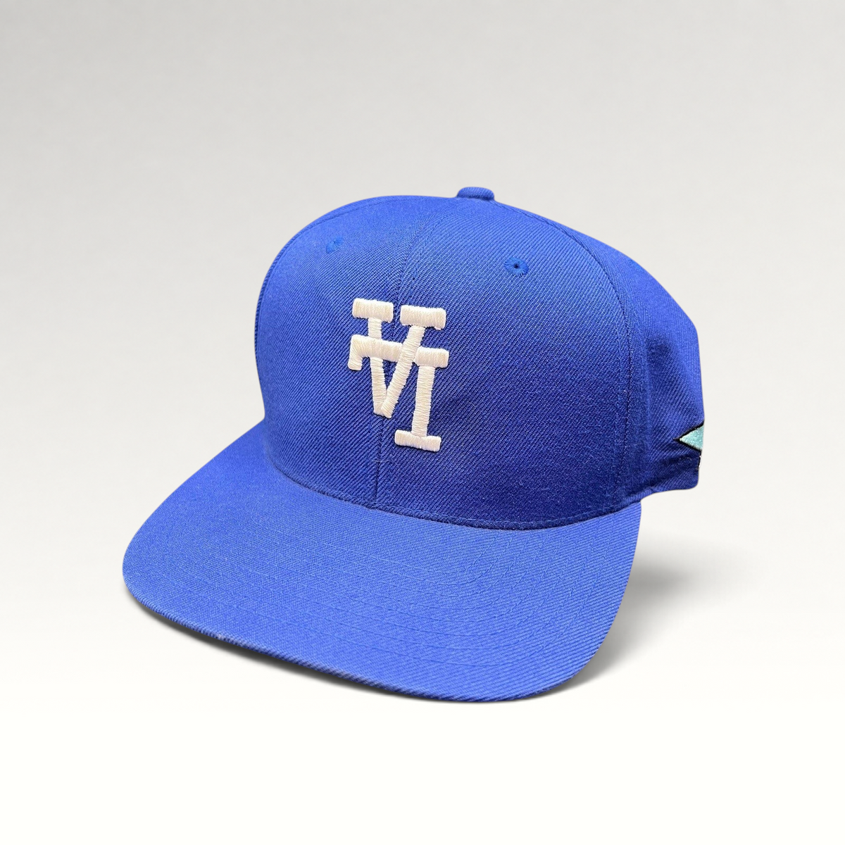 Raree Finds royal blue Uniform Studios Los Angeles snapback hat with white embroidered logo and green undervisor