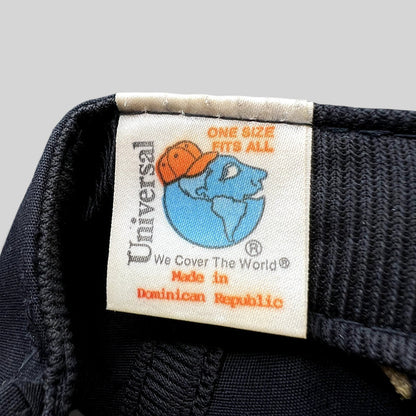 Raree Finds vintage Universal Industries hat interior tag showing globe logo and Made in Dominican Republic text