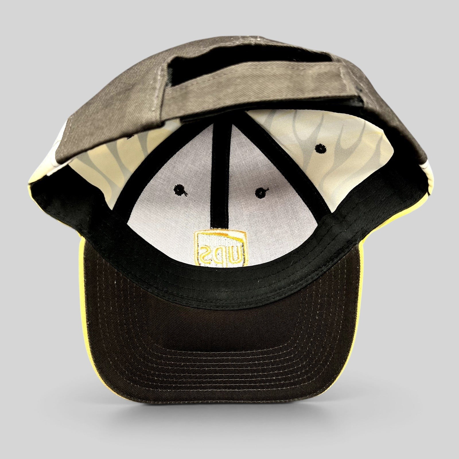 Raree Finds vintage brown and yellow UPS strapback hat with flame side panels and interior embroidered logo detail