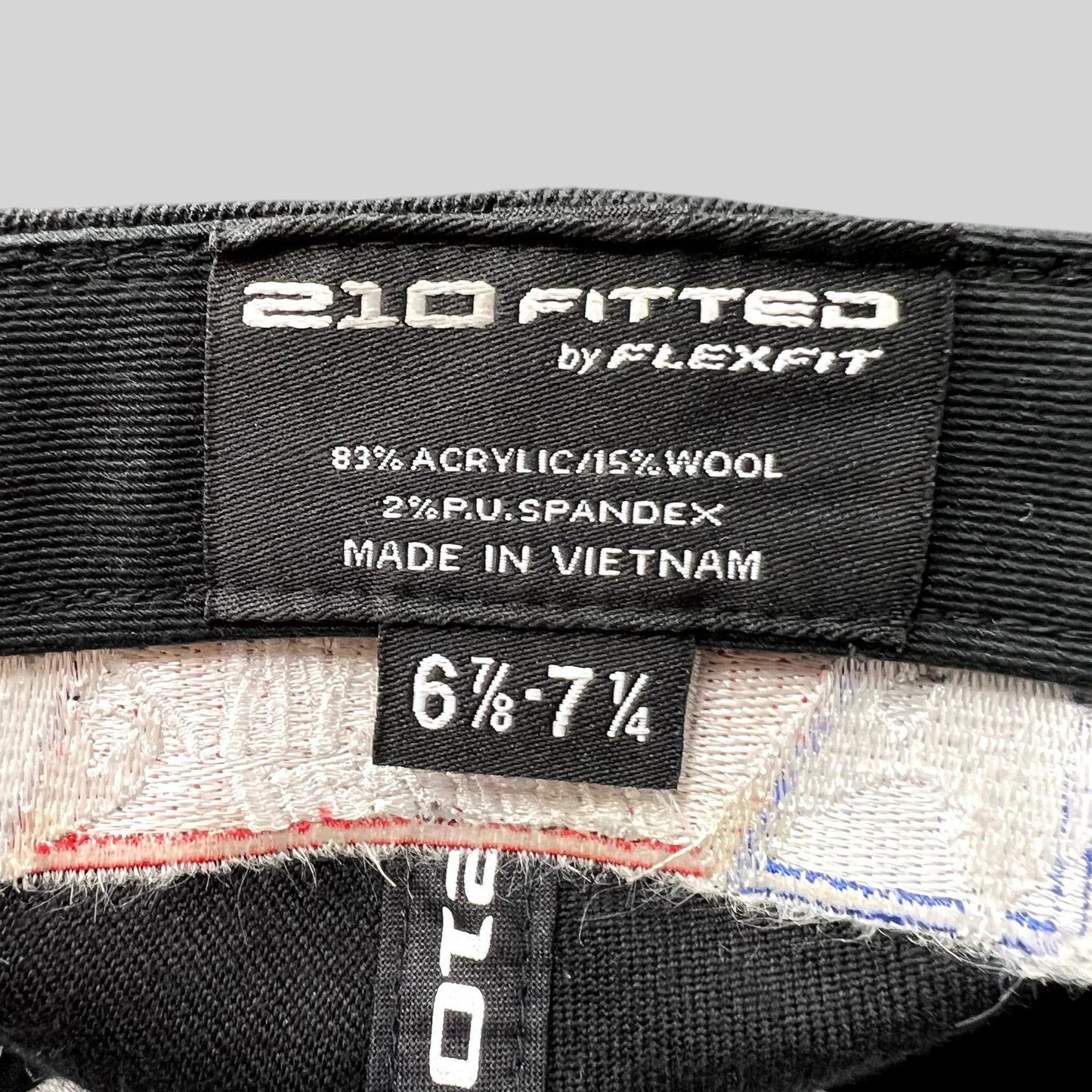 Raree Finds 2011 USASA National Championships hat interior label showing Flexfit 210 sizing and material composition