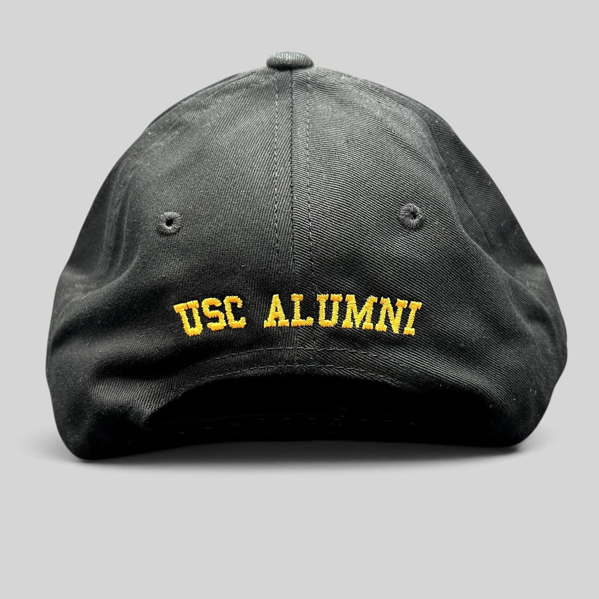 Raree Finds black USC Trojans Alumni snapback hat with yellow embroidered text on the back