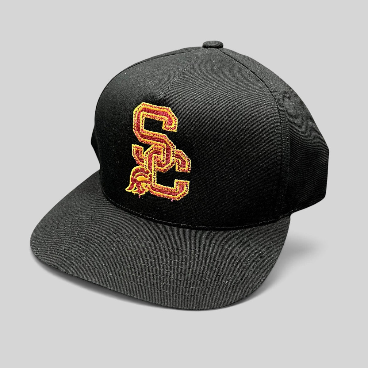 Raree Finds vintage USC Trojans snapback hat in black cotton with cardinal and gold embroidered interlocking SC logo