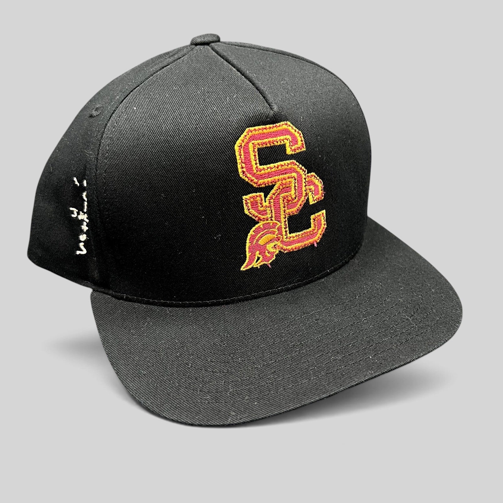 Raree Finds black USC Trojans snapback hat with cardinal and gold embroidered SC logo and green undervisor