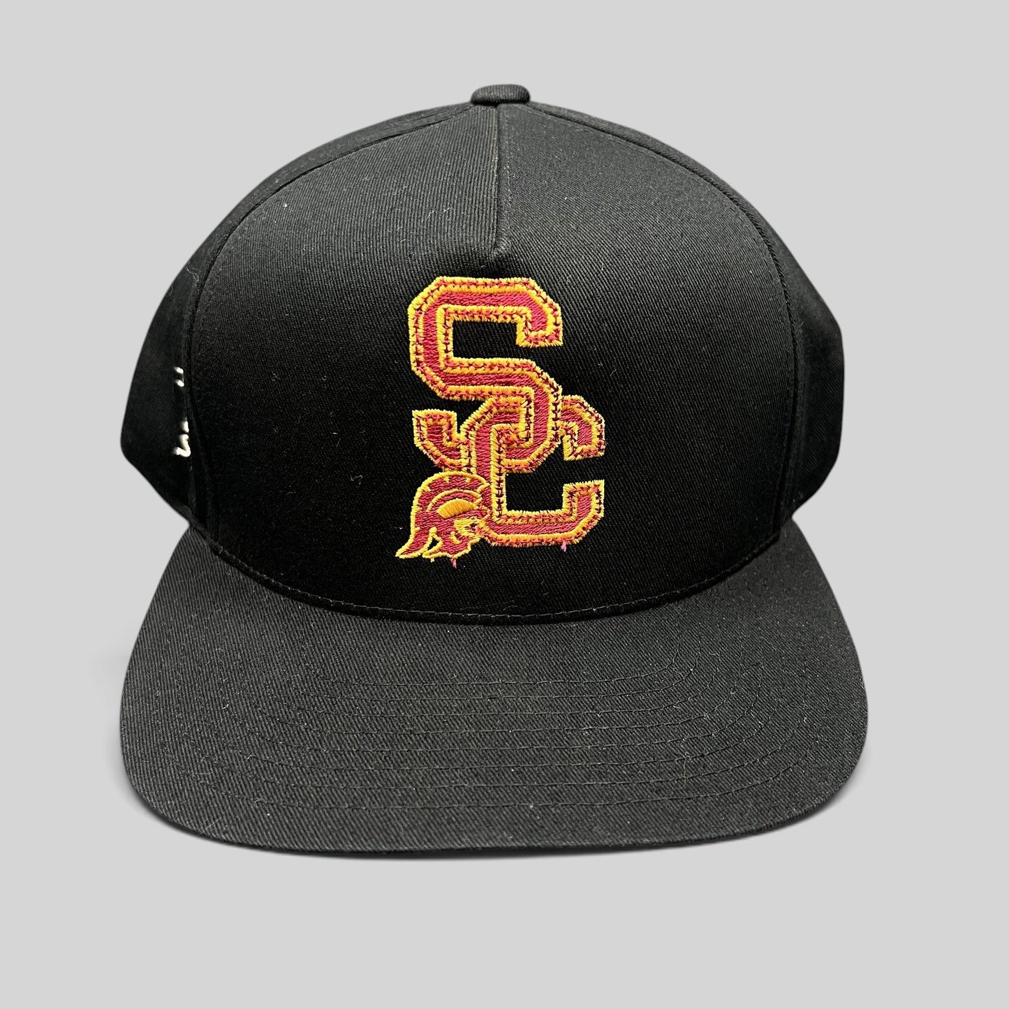 Raree Finds vintage black USC Trojans snapback hat with cardinal and gold embroidered SC logo and green undervisor