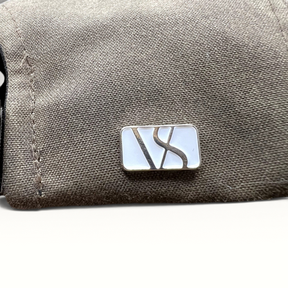 Raree Finds Varsity Headwear olive brown strapback hat featuring a polished metal logo detail on the side panel