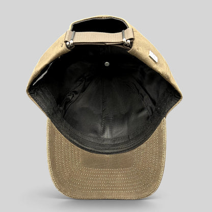 Raree Finds Varsity Headwear brown minimalist strapback cap showing the interior lining and adjustable nylon strap.