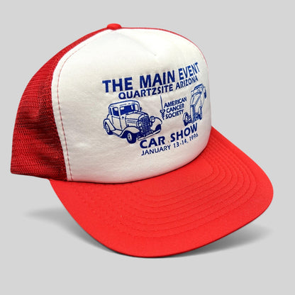 Raree Finds vintage 1996 Quartzsite AZ car show trucker hat with white foam front, red mesh back, and blue graphics.