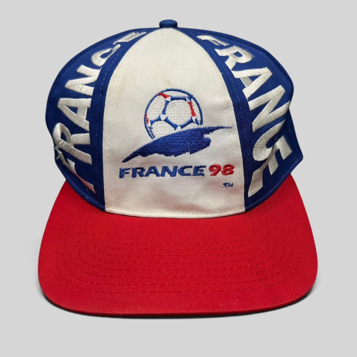 Raree Finds vintage 1998 France World Cup snapback hat in blue, white, and red with embroidered soccer logo