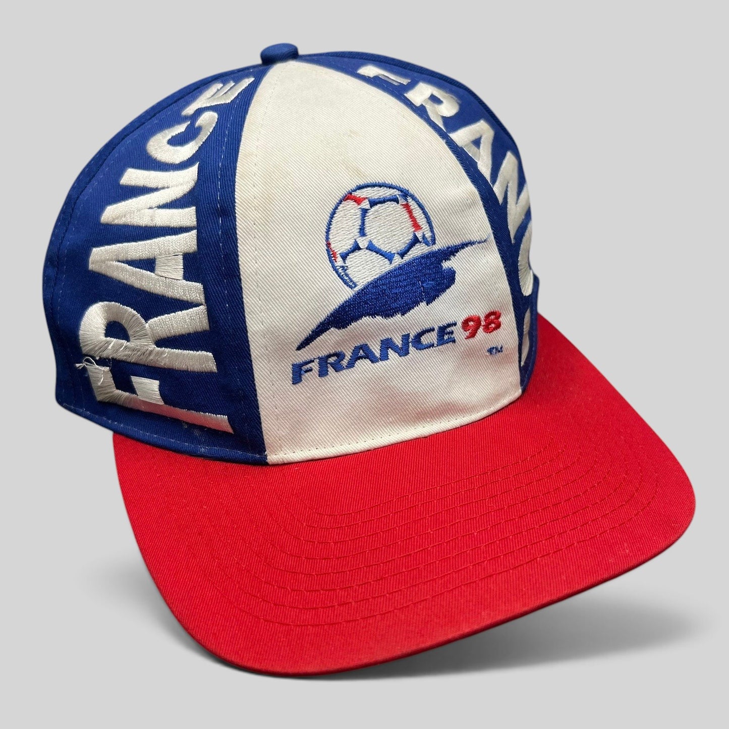 Raree Finds vintage 1998 France World Cup snapback hat in blue, white, and red with embroidered soccer logo