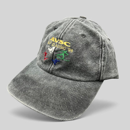 Raree Finds vintage 1998 AVSC Golf Classic Cobra strapback hat in washed black cotton with colorful embroidered graphics.