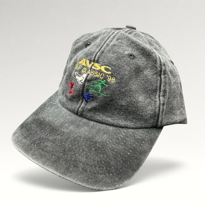 Raree Finds vintage 1998 AVSC Golf Classic Cobra strapback hat in washed black cotton with colorful embroidered graphics.
