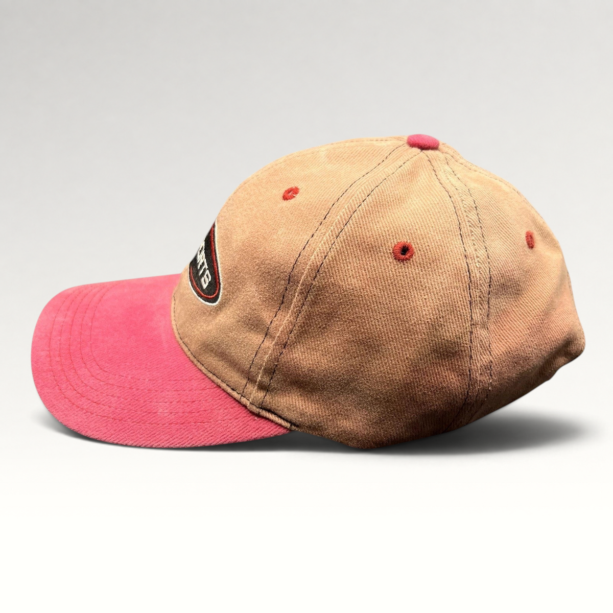 Raree Finds vintage ABC Sports strapback hat with a tan crown and pink brim featuring an embroidered front logo.