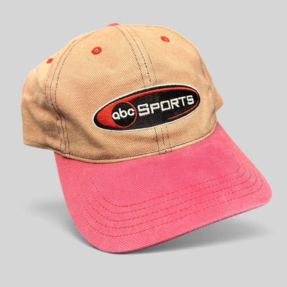 Raree Finds vintage ABC Sports strapback hat with a tan crown, pink brim, and embroidered logo on the front.