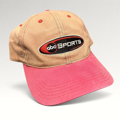 Raree Finds vintage ABC Sports strapback hat with a tan crown, pink brim, and embroidered logo on the front.