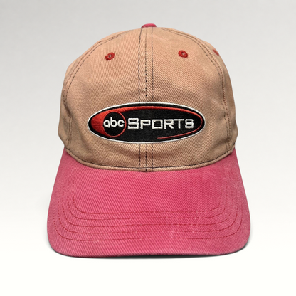 Raree Finds vintage ABC Sports strapback hat with a tan crown and pink brim featuring an embroidered front logo.