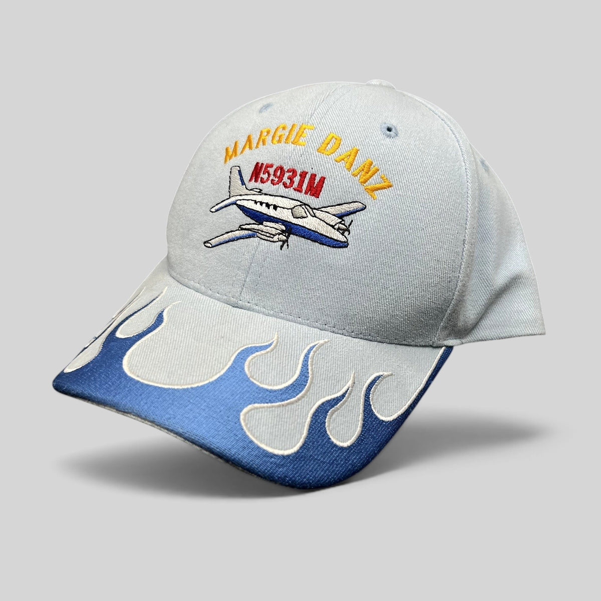 Raree Finds vintage light blue strapback hat with Margie Danz N5931M airplane embroidery and blue flame visor design.