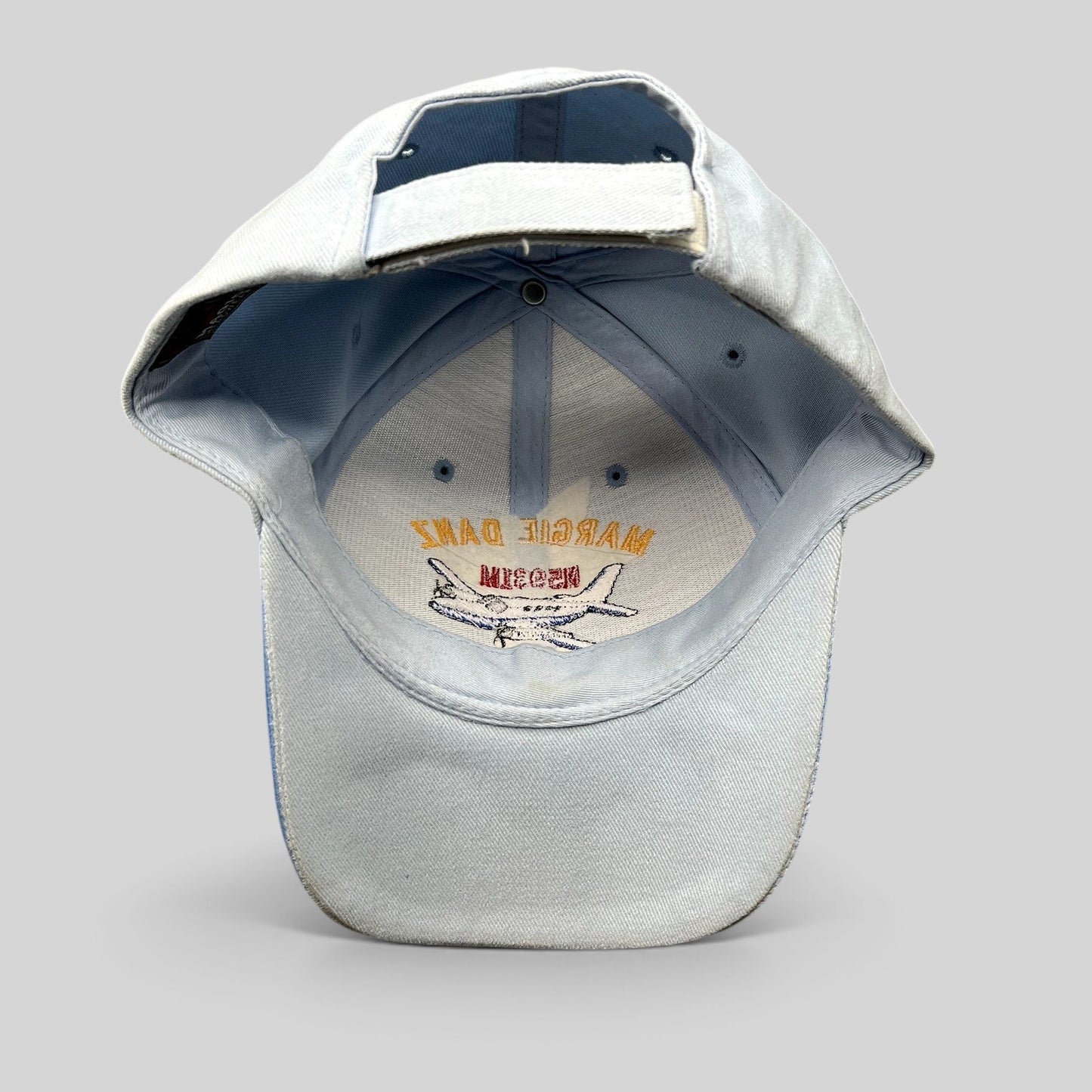 Raree Finds vintage light blue strapback hat featuring Margie Danz N5931M airplane embroidery on the inner crown