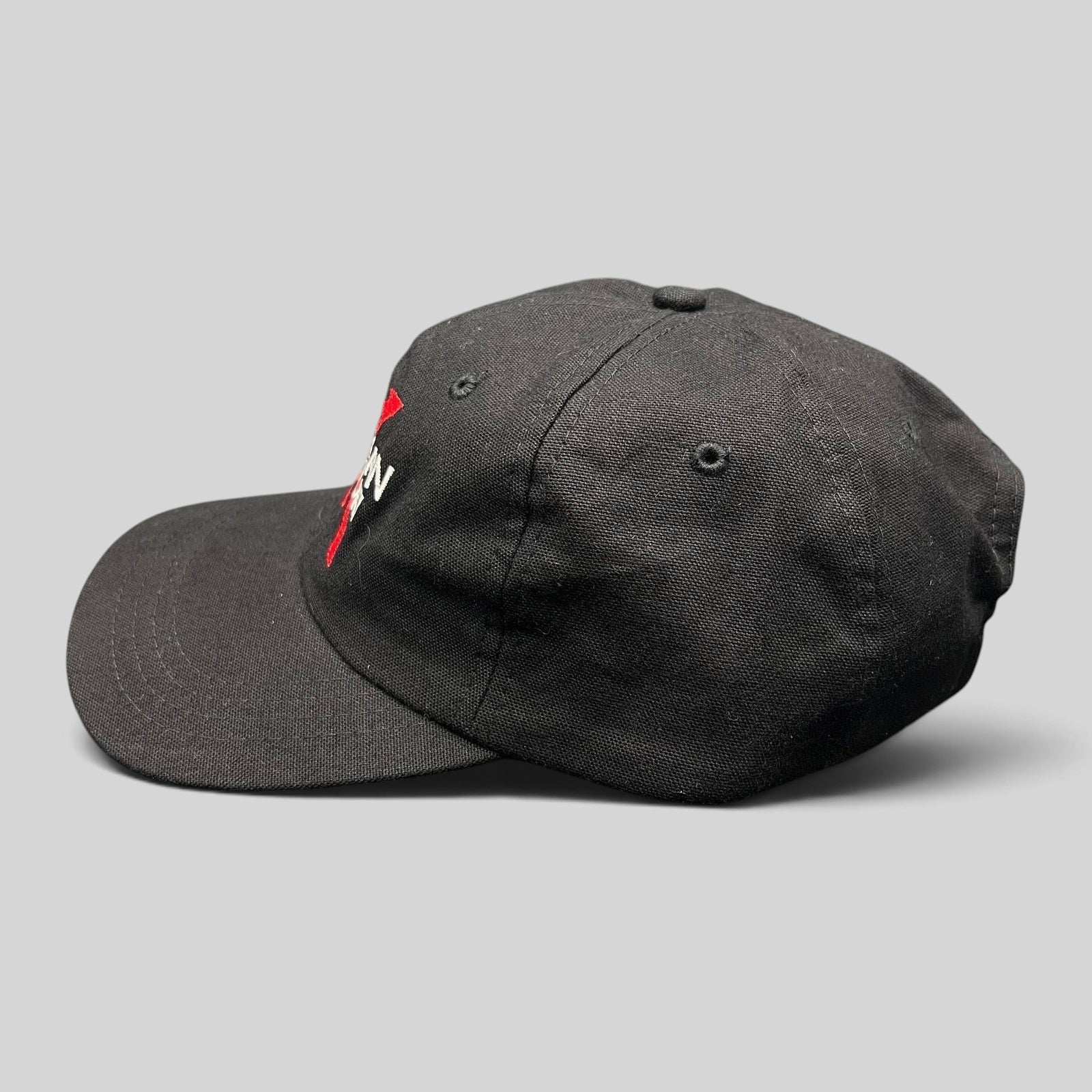Raree Finds vintage 1998 American History X black cotton snapback hat with red and white embroidered logo side view