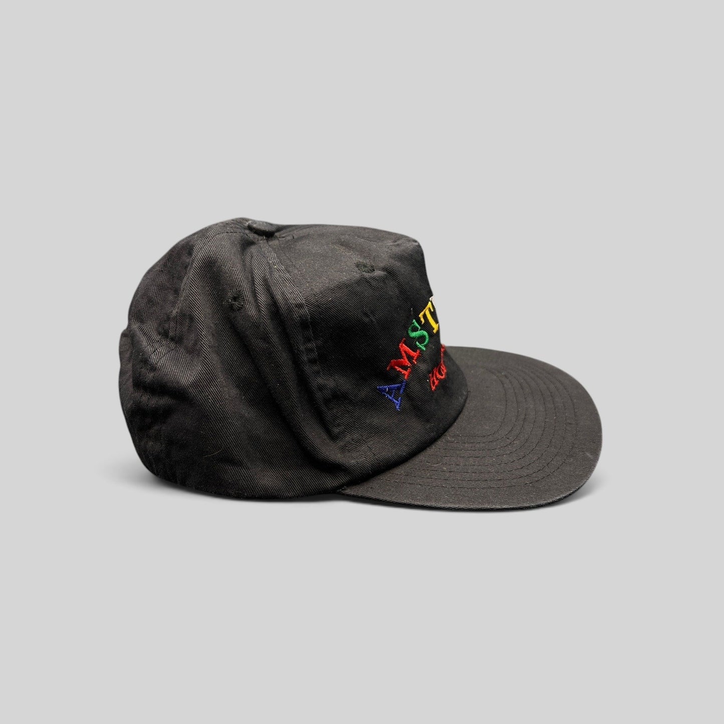 Raree Finds vintage 1990s black cotton snapback hat with colorful Amsterdam Holland rainbow embroidery