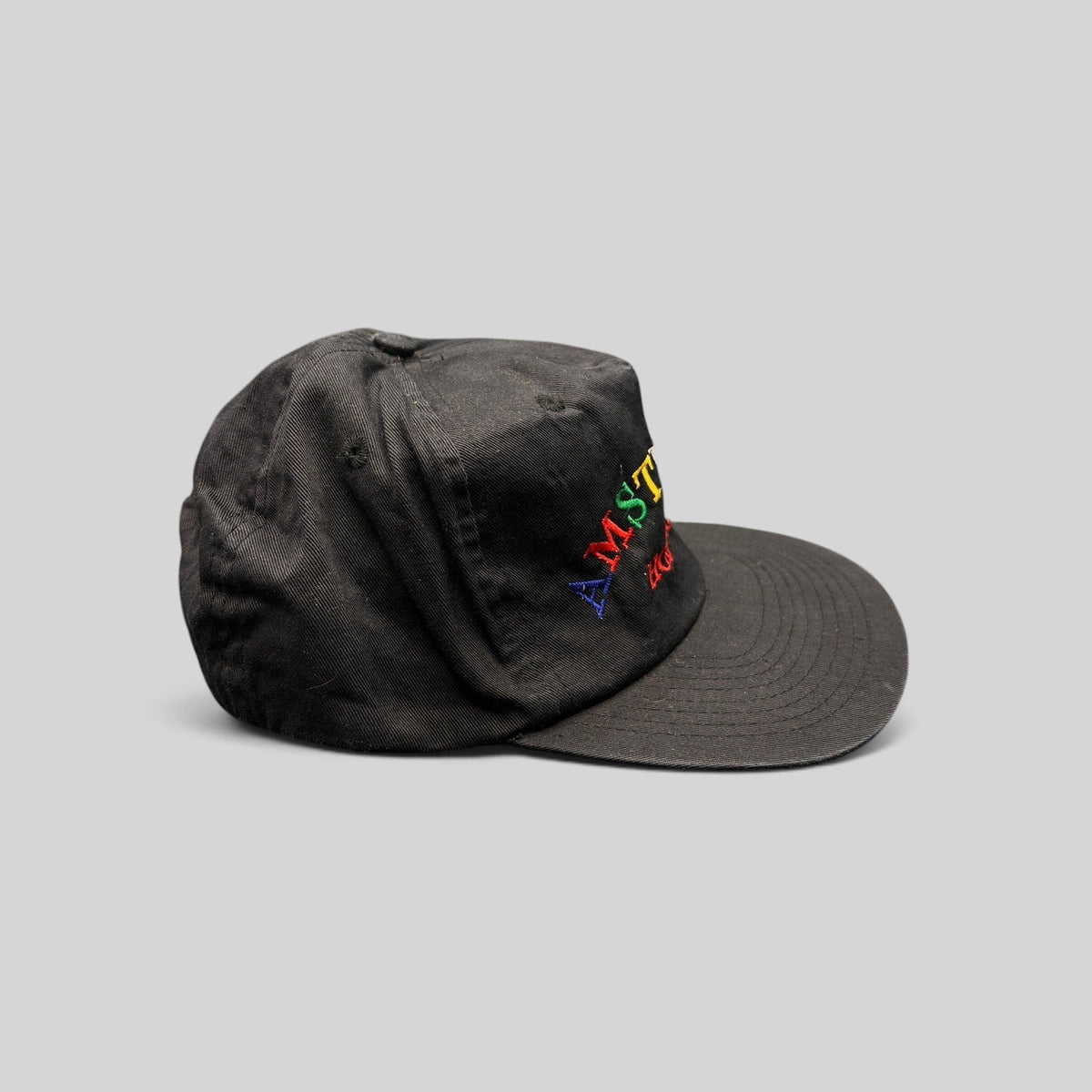 Raree Finds vintage 1990s black cotton snapback hat with colorful Amsterdam Holland rainbow embroidery