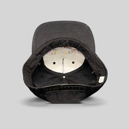 Raree Finds vintage 1990s Amsterdam Holland black cotton snapback hat, interior view showing plastic snap closure.