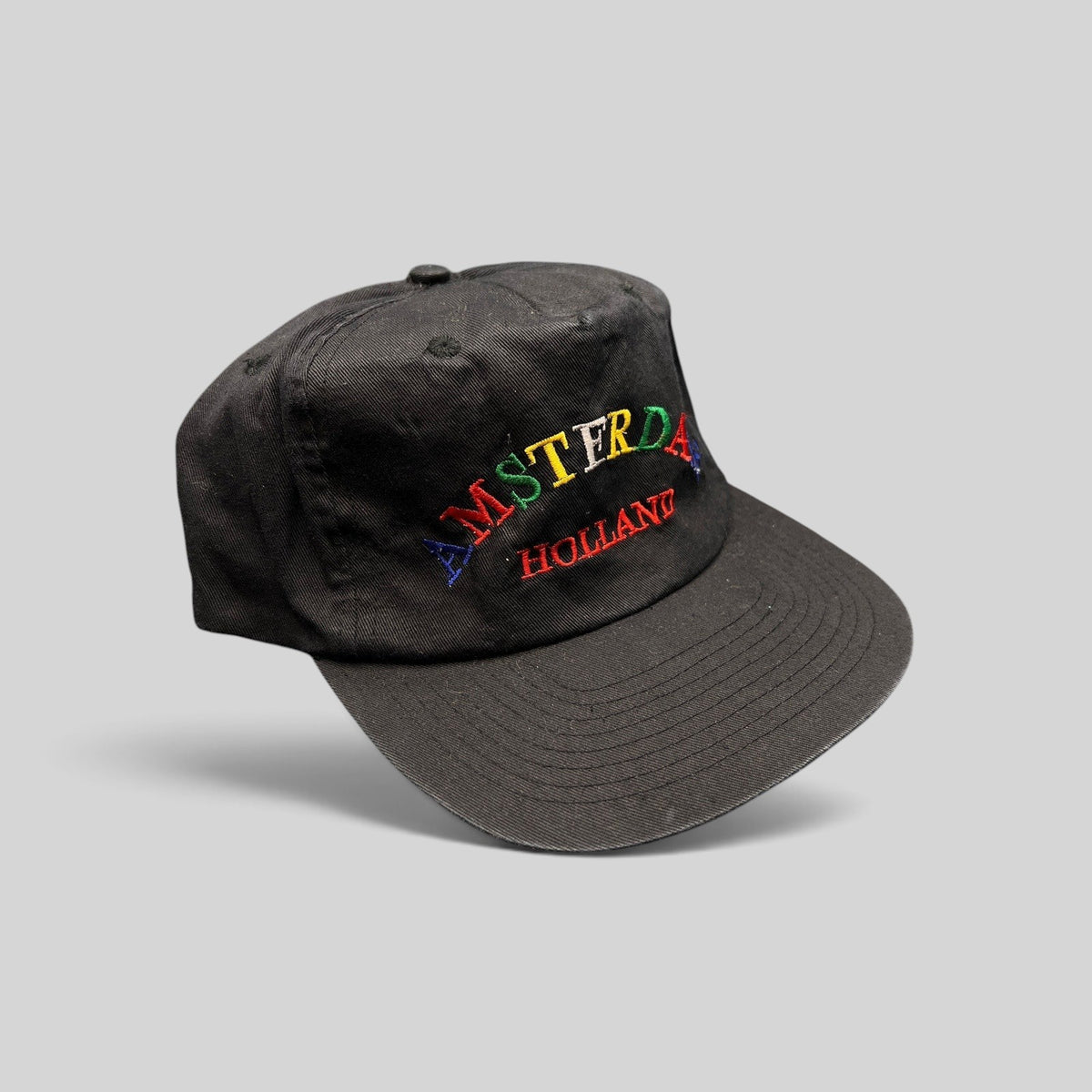 Raree Finds vintage 1990s black cotton snapback hat with colorful Amsterdam Holland rainbow embroidery
