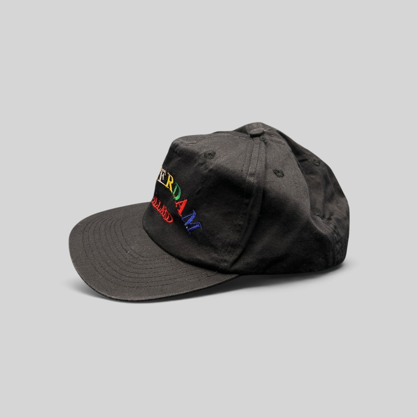 Raree Finds vintage 1990s black cotton snapback hat with colorful Amsterdam Holland rainbow embroidery