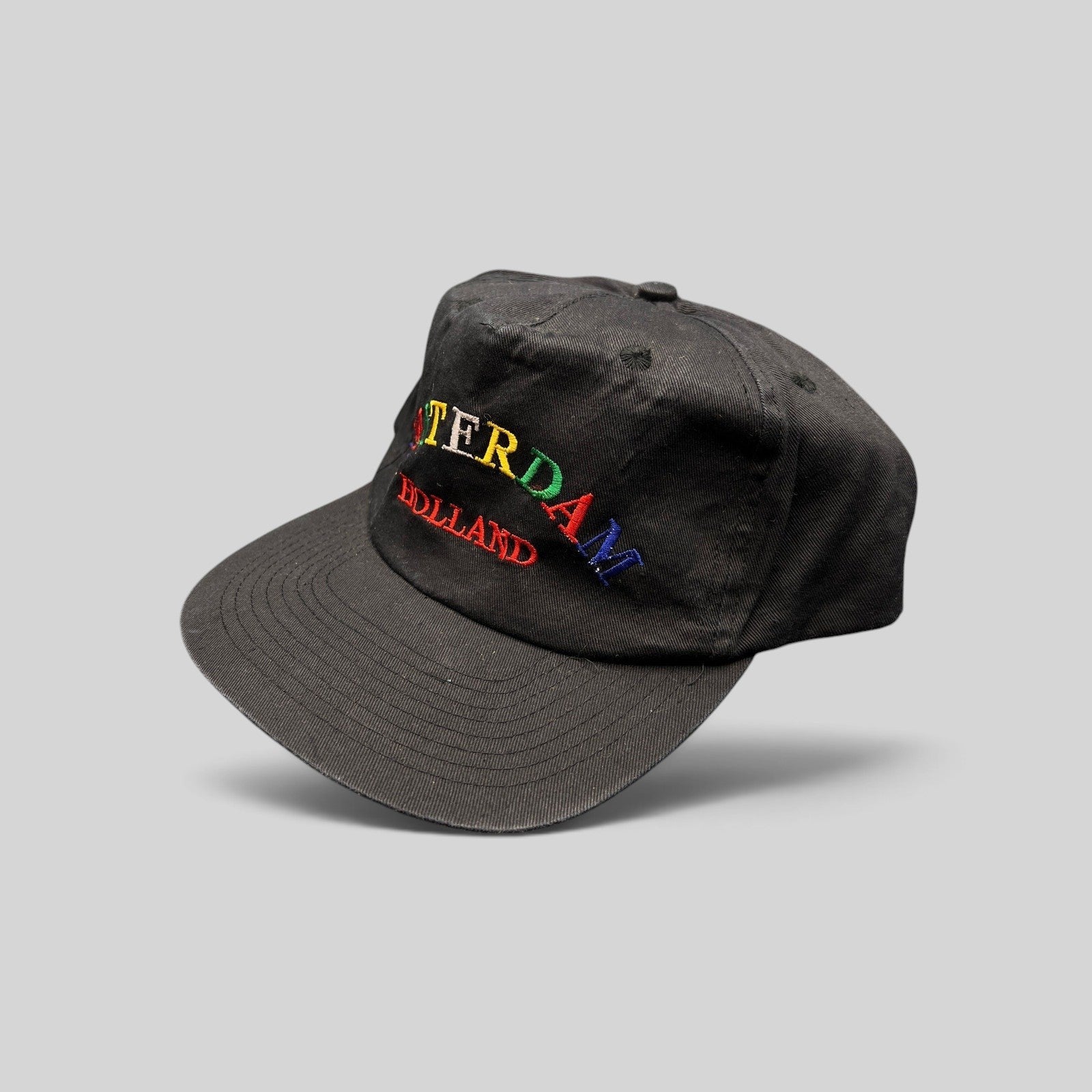 Raree Finds vintage 1990s black cotton snapback hat with colorful embroidered Amsterdam Holland lettering