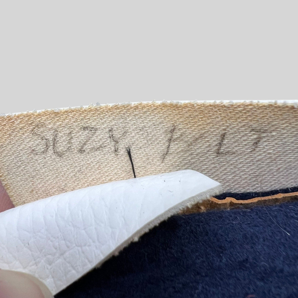 Raree Finds vintage California Angels snapback interior showing the leatherette sweatband with handwritten marking