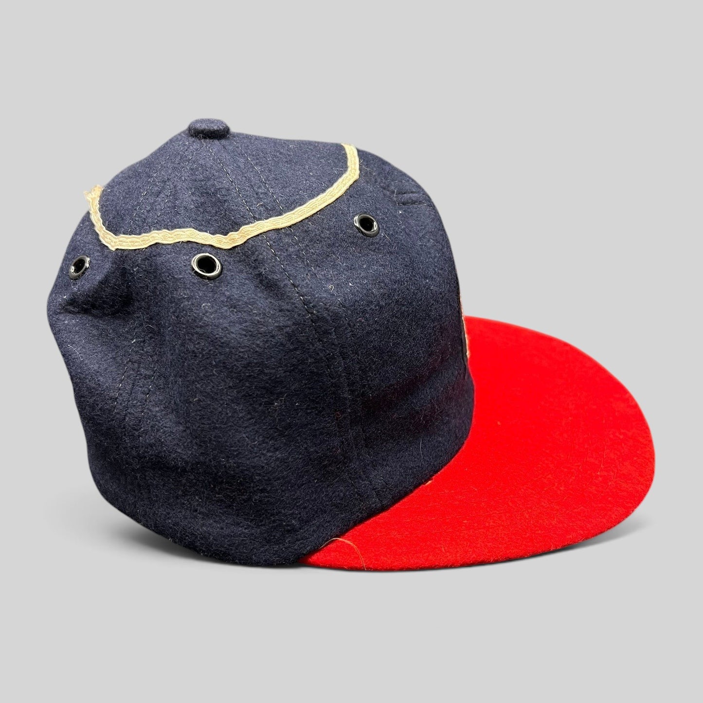 Raree Finds vintage California Angels wool snapback hat with a navy crown, red brim, and metal eyelets.