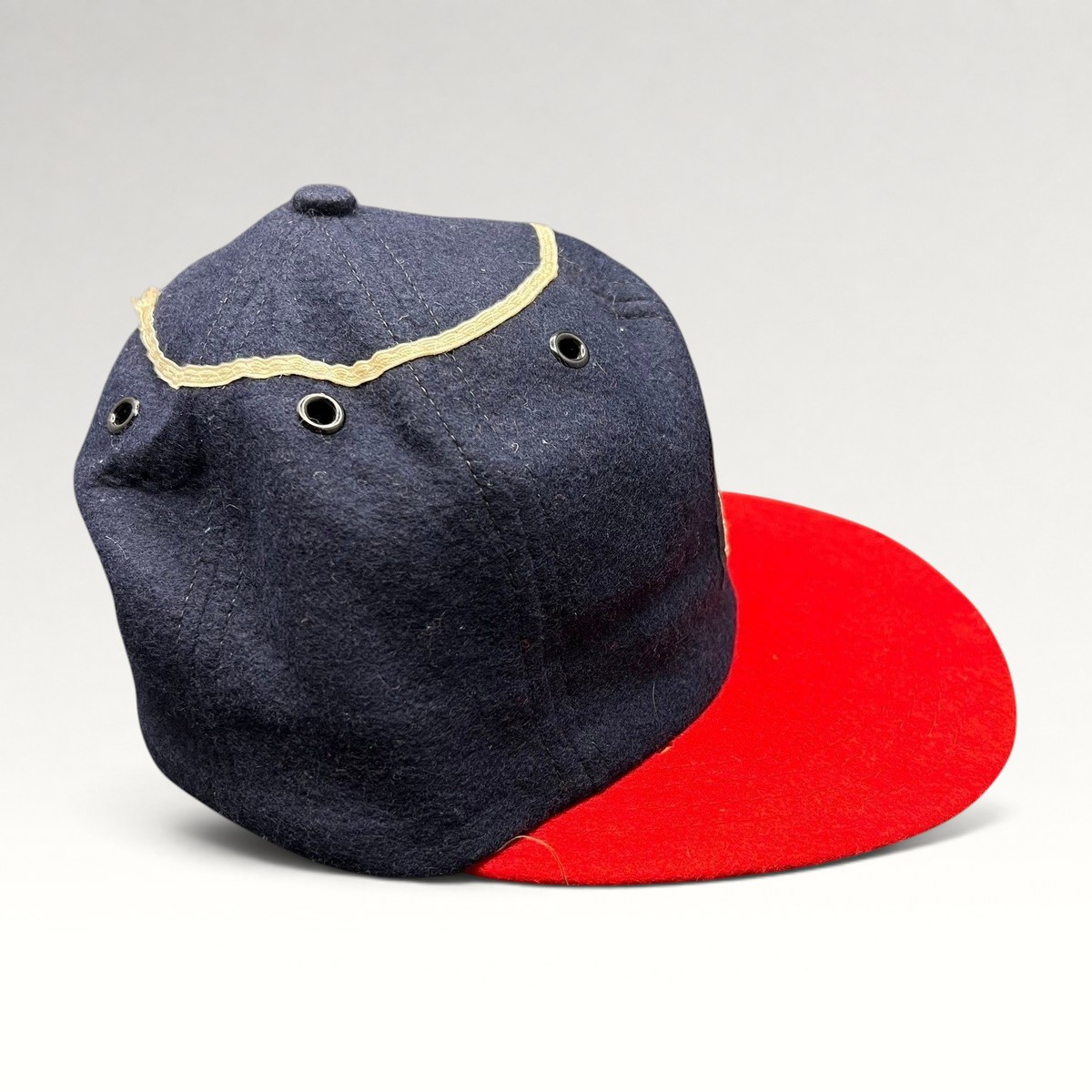 Raree Finds vintage California Angels wool snapback hat with a navy crown, red brim, and metal eyelets.
