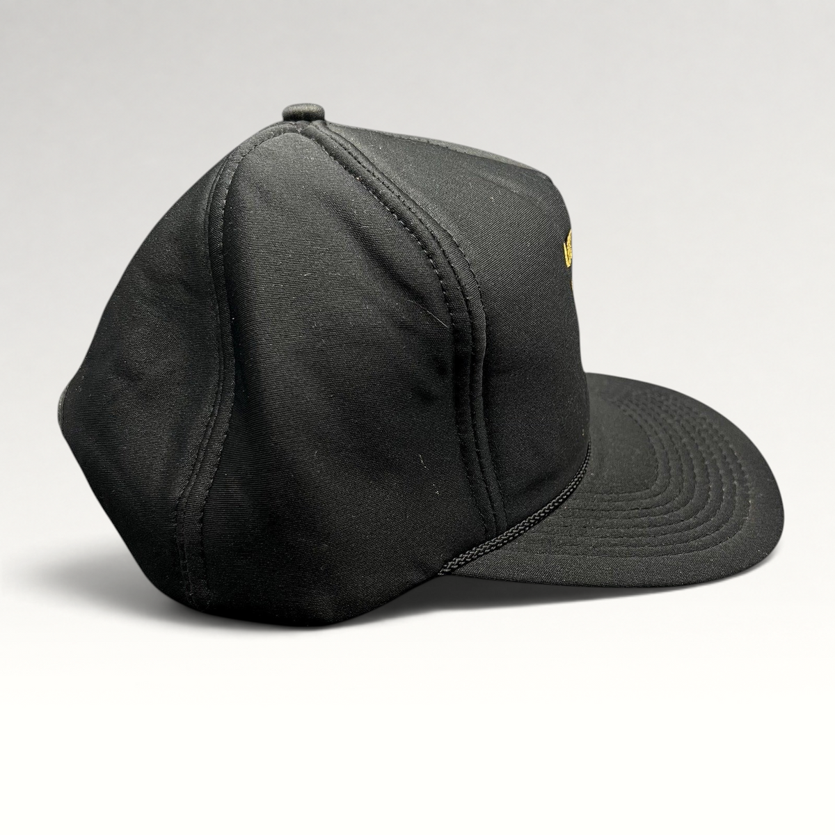 Raree Finds vintage black ARCO Marine snapback hat with foam front, black rope brim detail, and structured crown.