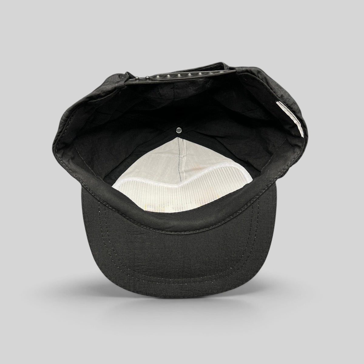 Raree Finds vintage 1995 Aspen Air Show black nylon snapback hat, interior view showing white mesh lining and strap.