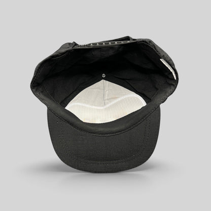Raree Finds vintage 1995 Aspen Air Show black nylon snapback hat, interior view showing white mesh lining and strap.